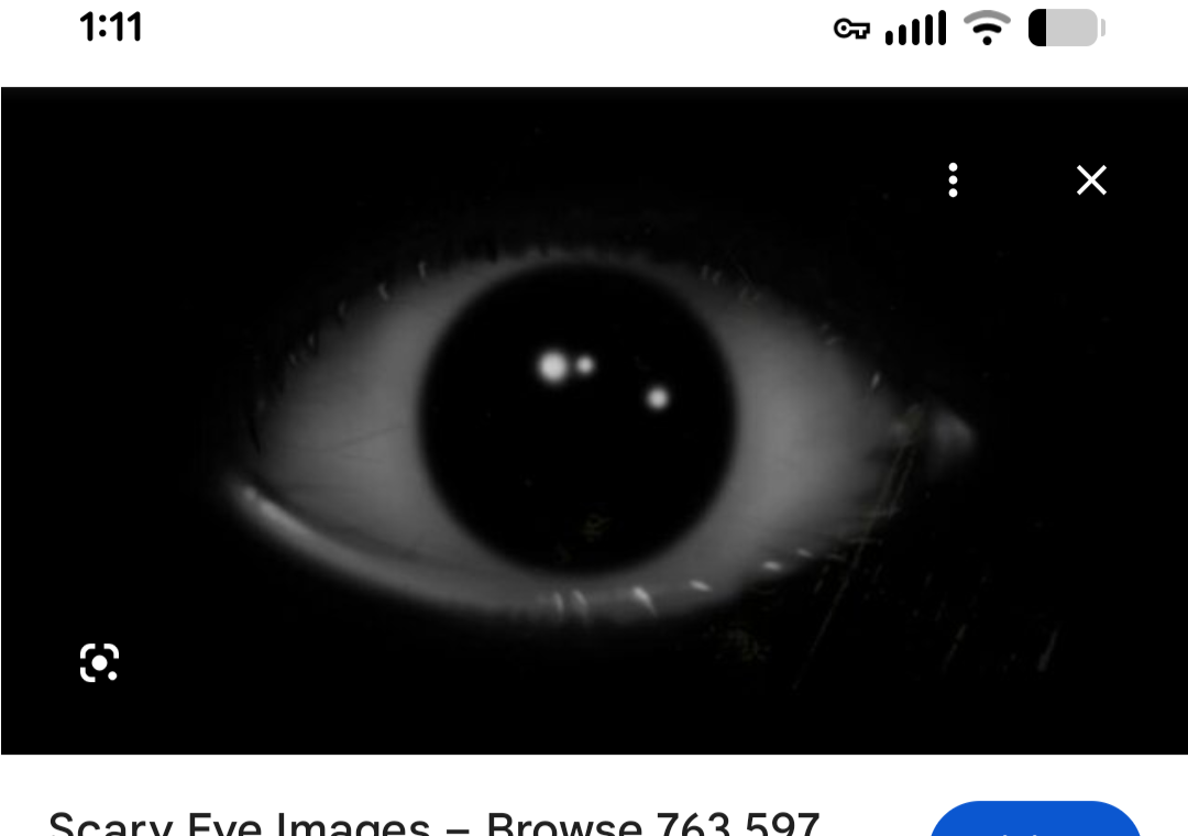 stock image of a scary eye, once again a terribly cropped screenshot on a phone