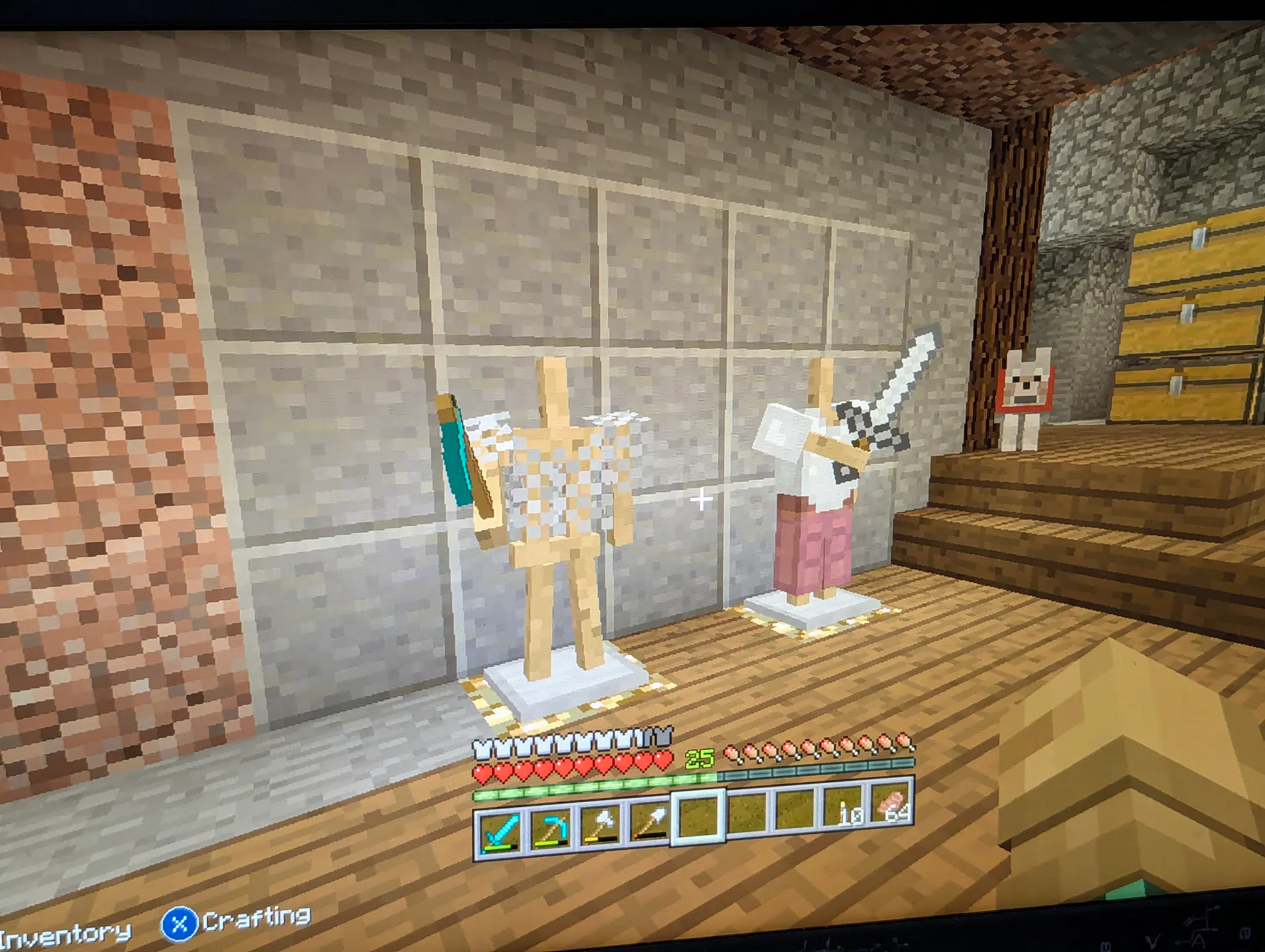 Two armor stands, one with a sword and some leather and iron armor, the other with a chainmail chest plate and diamond hoe